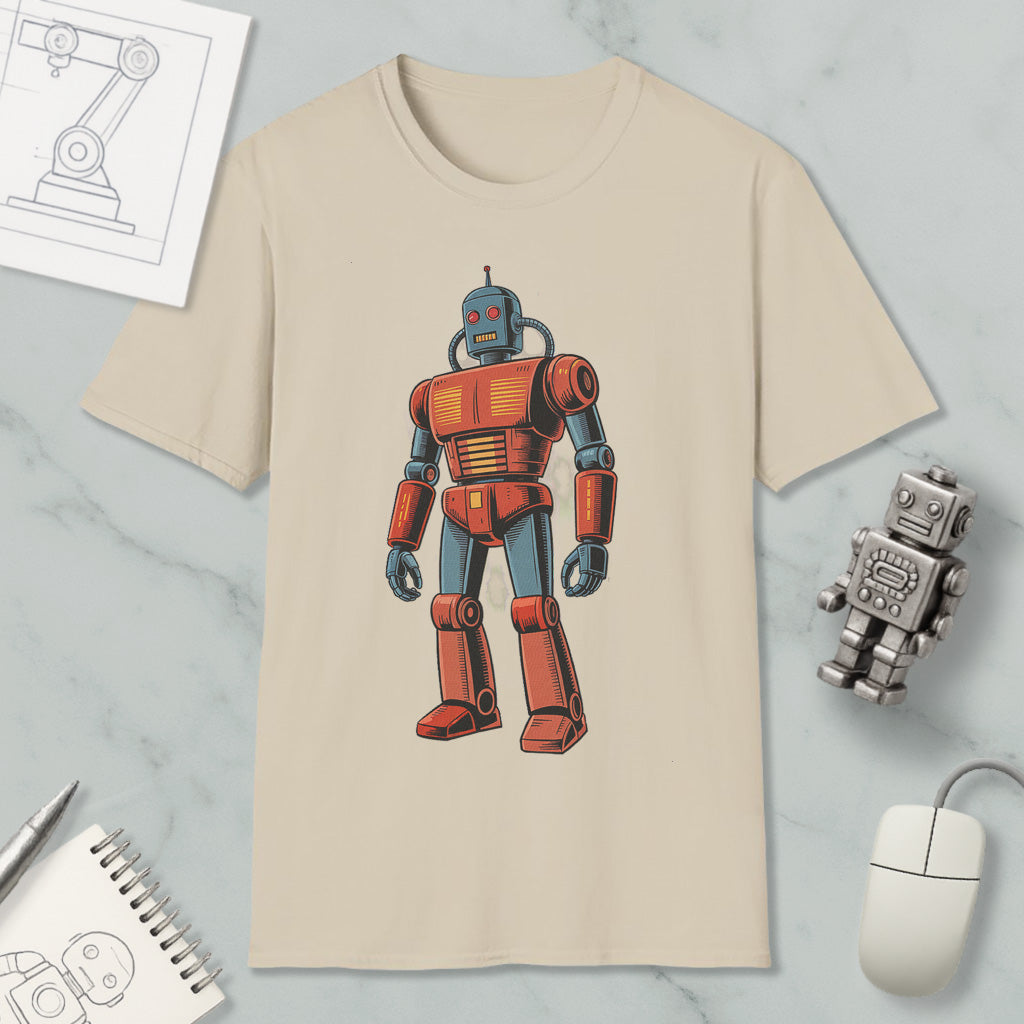 a beige t-shirt with a colorful illustration of a robot, along with various objects such as a computer mouse, a notebook, and a pen.