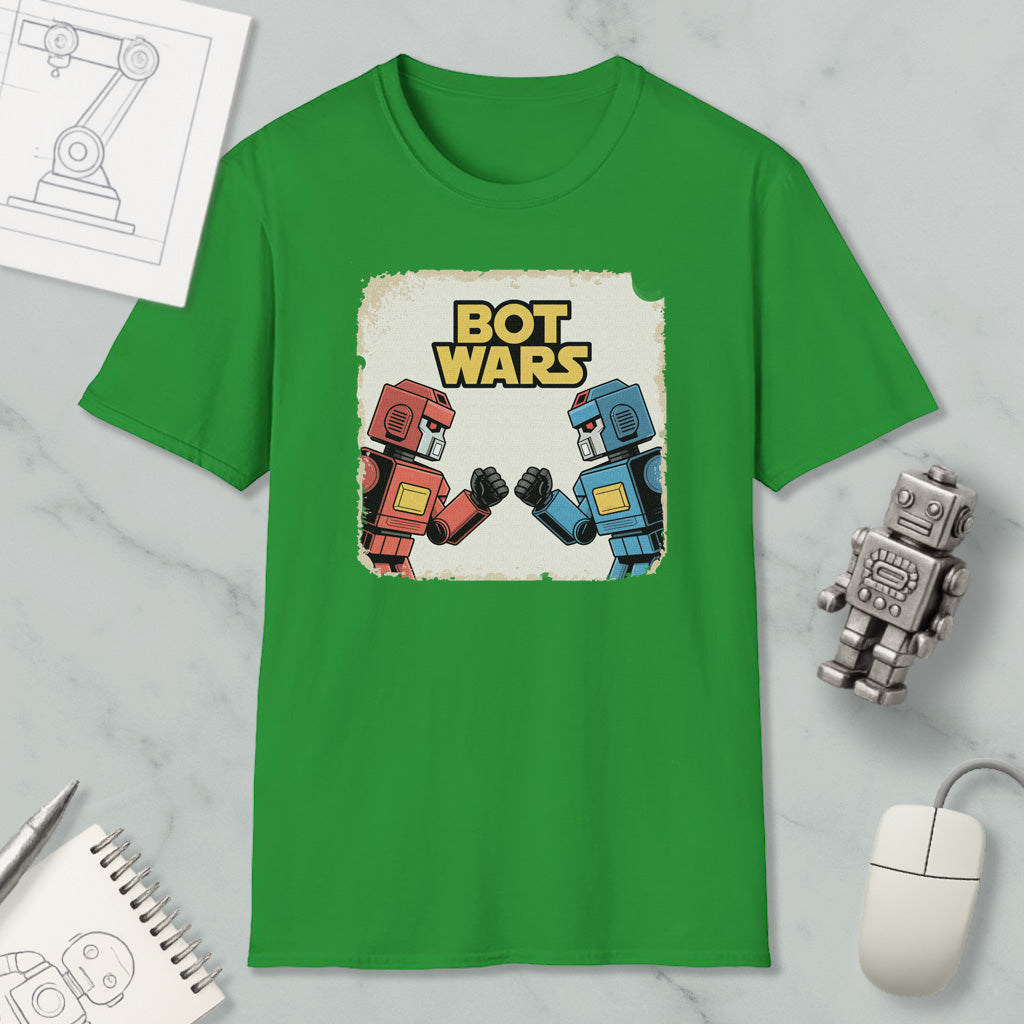 a green t-shirt with a graphic design of two robot characters, one red and one blue, engaged in a battle or fight. The t-shirt is displayed on a marble surface, along with various objects such as a computer mouse, a pen, and a notebook.