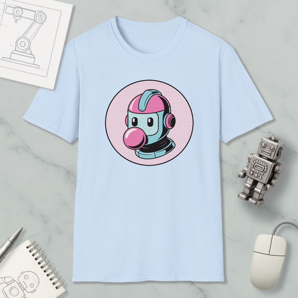 a light blue t-shirt with a cartoon robot design, along with various objects such as a computer mouse, a notebook, and a pen.