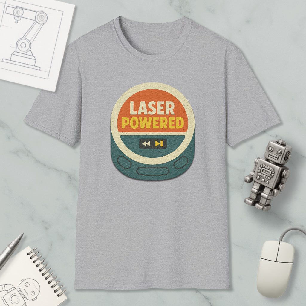 a gray t-shirt with a graphic design that says "LASER POWERED" in bold letters, surrounded by various objects such as a computer mouse, a robot, and a notebook.