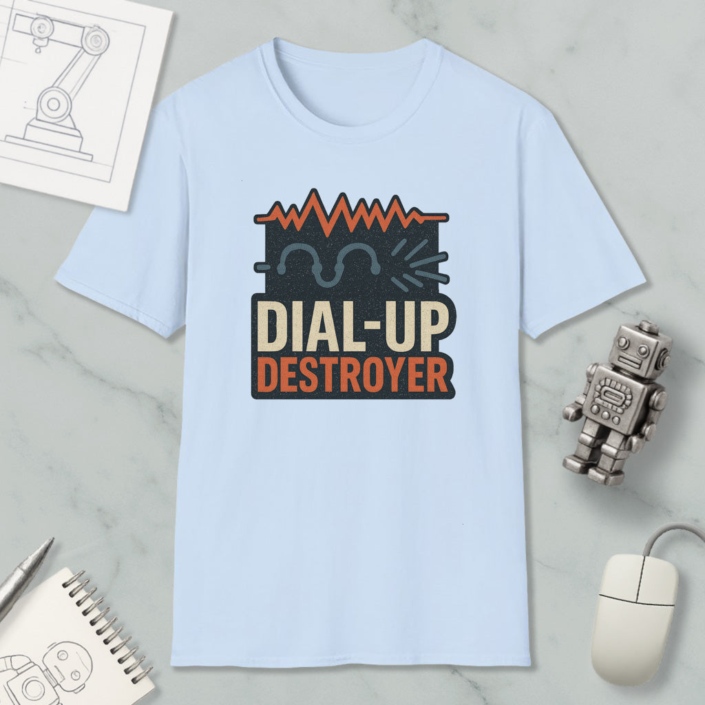 a light blue t-shirt with a graphic design, a computer mouse, a notebook, and a small robot on a marble surface.