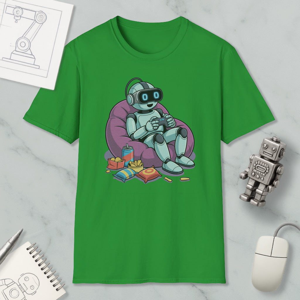 a green t-shirt with a cartoon robot sitting in a bean bag chair, holding a drink and surrounded by various objects such as a toy robot, a notebook, and a mouse.