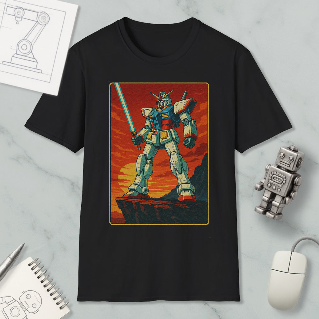 a black t-shirt with a graphic design depicting a robot or mechanical figure, standing on a cliff or rocky outcropping against a sunset or sunset-like background.