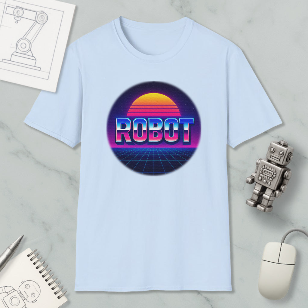 a light blue t-shirt with a graphic design of a robot and a sunset, along with various objects such as a computer mouse, a notebook, and a pen.