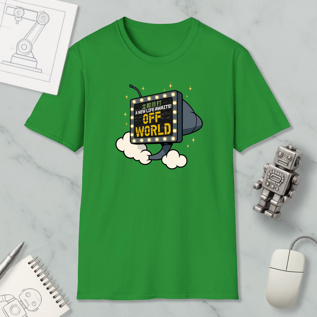 a green t-shirt with a graphic design, a computer mouse, a notebook, and a robot figurine on a marble surface.