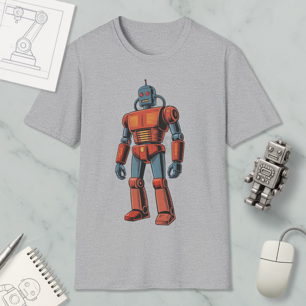 a gray t-shirt with a robot graphic printed on it, along with various objects such as a computer mouse, a notebook, and a pen.