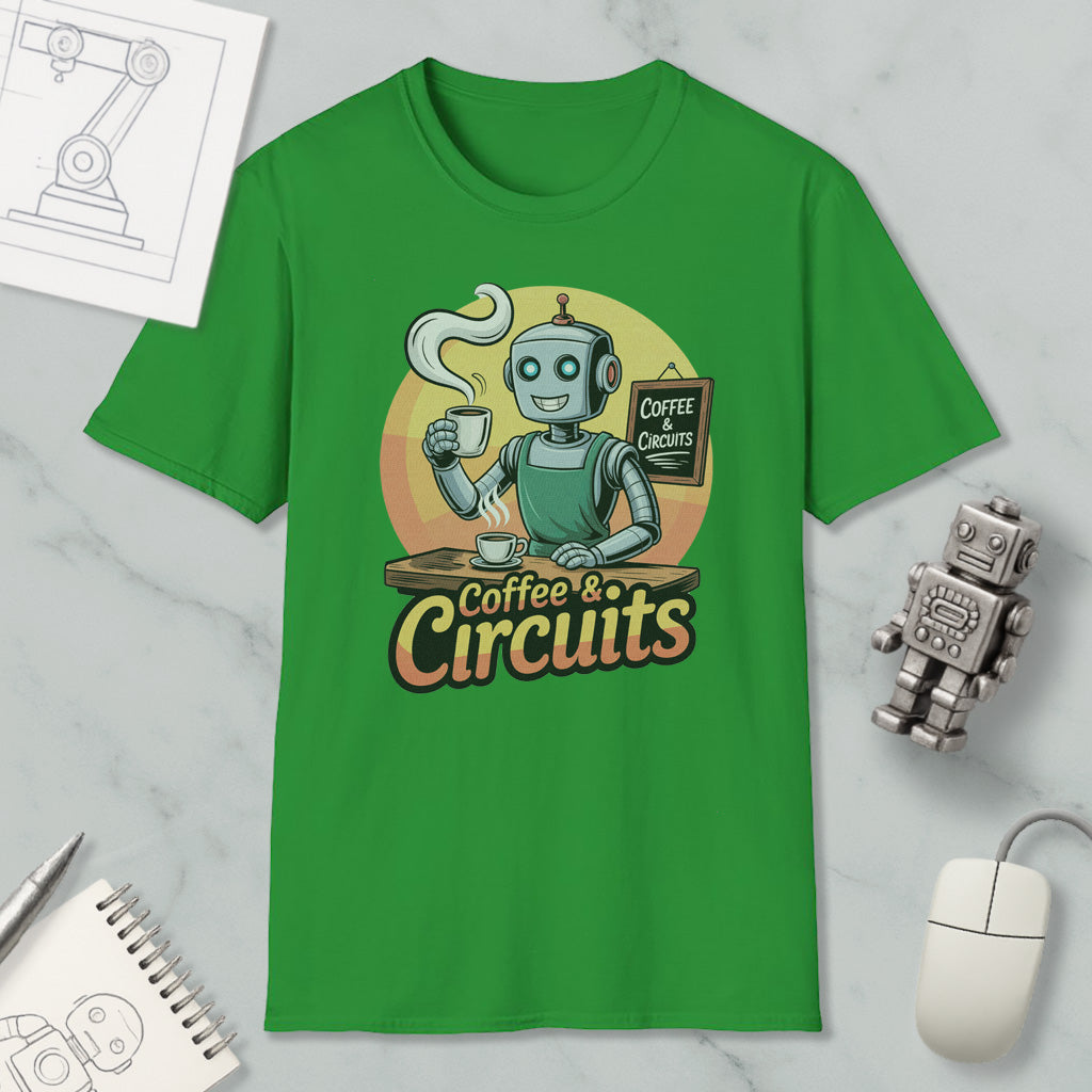 a green t-shirt with a graphic design of a robot holding a cup of coffee and a sign that says "Coffee & Circuits". The t-shirt is displayed on a marble surface, along with a computer mouse, a notebook, and a small robot figurine.