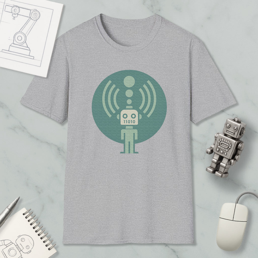 a gray t-shirt with a green circular design depicting a robot, along with various objects such as a computer mouse, a notebook, and a pen.