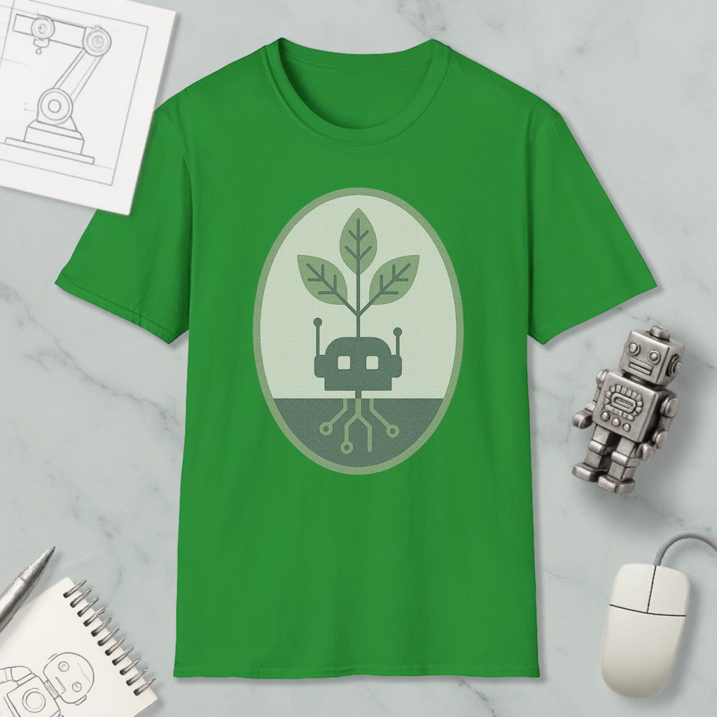 a green t-shirt with a graphic design, a small robot, a computer mouse, and a notebook on a marble surface.