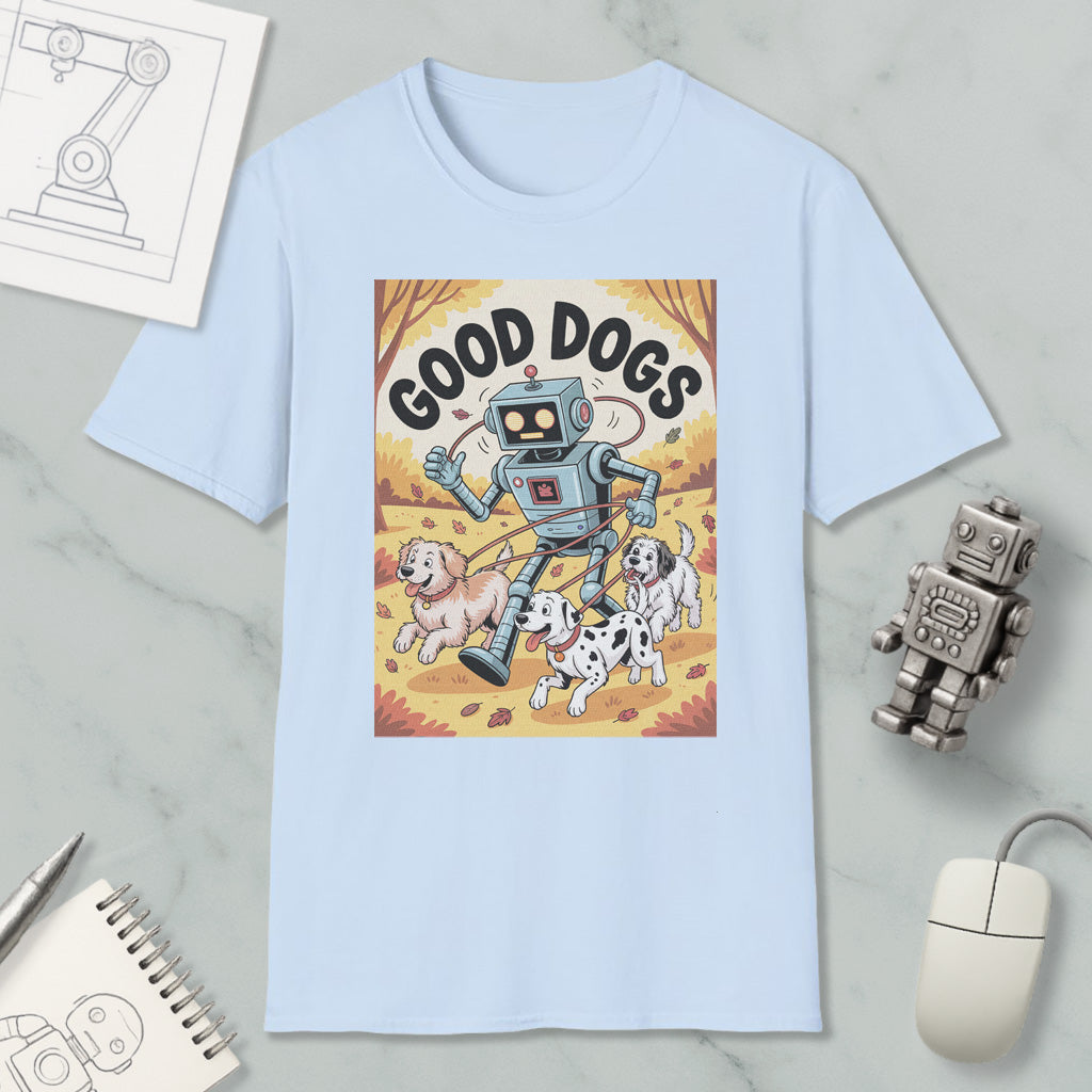 A light blue t-shirt with a cartoon robot and three dogs, along with a computer mouse and other office supplies, arranged on a marble surface.