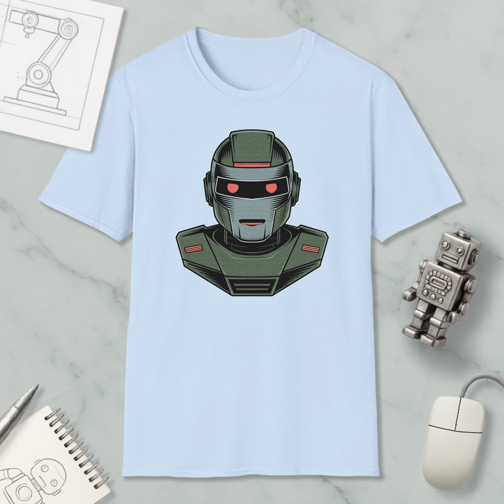 a light blue t-shirt with a graphic of a robot or robot-like character on it, along with various objects such as a computer mouse, a notebook, and a pen.