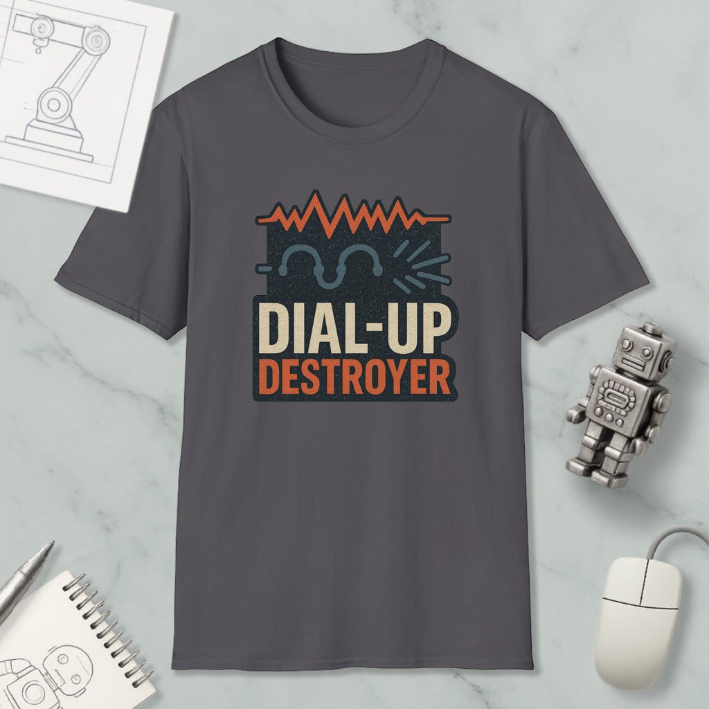 a gray t-shirt with a graphic design, a computer mouse, a notebook, and a small robot on a marble surface.