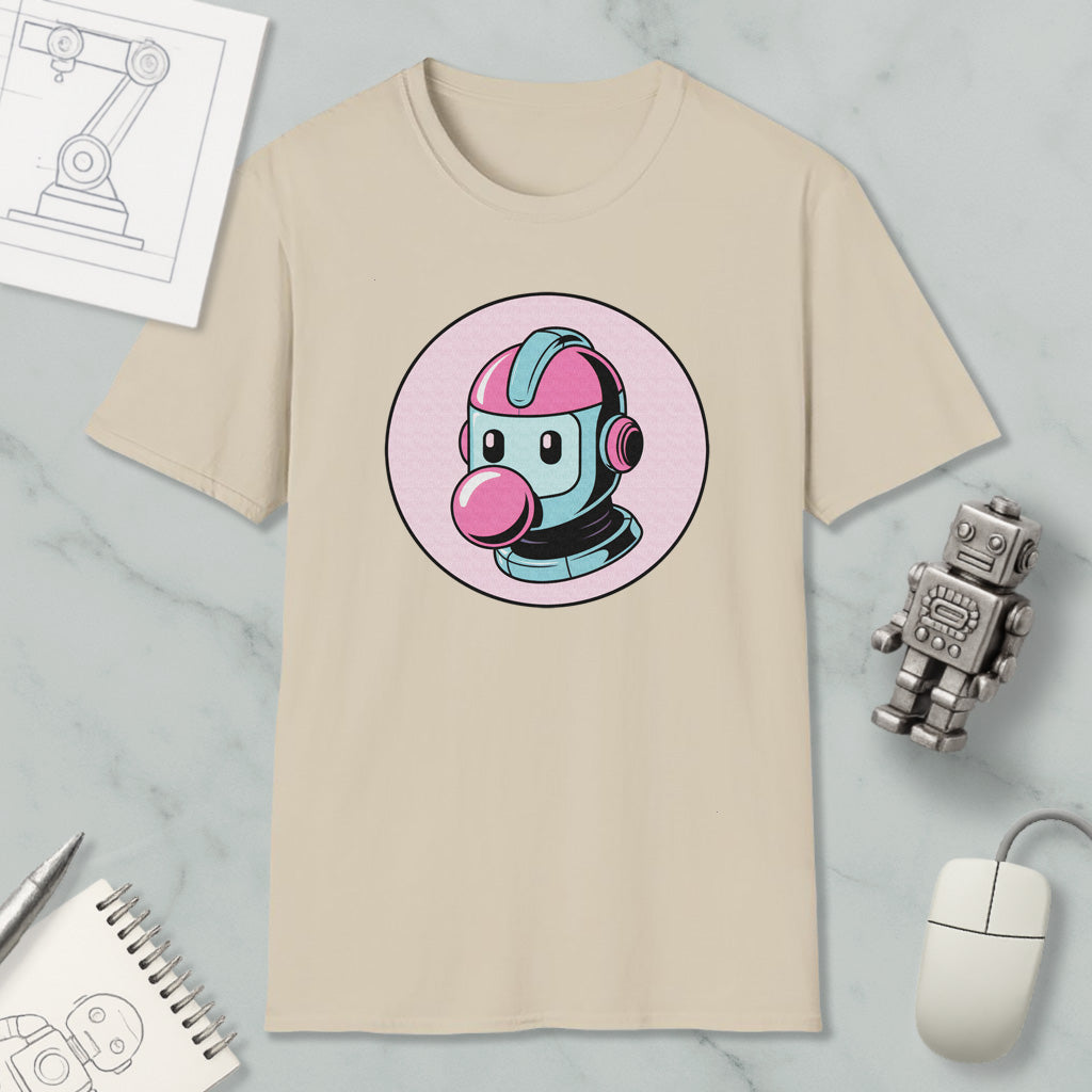 a beige t-shirt with a cartoon robot design, along with various objects such as a computer mouse, a notebook, and a pen.