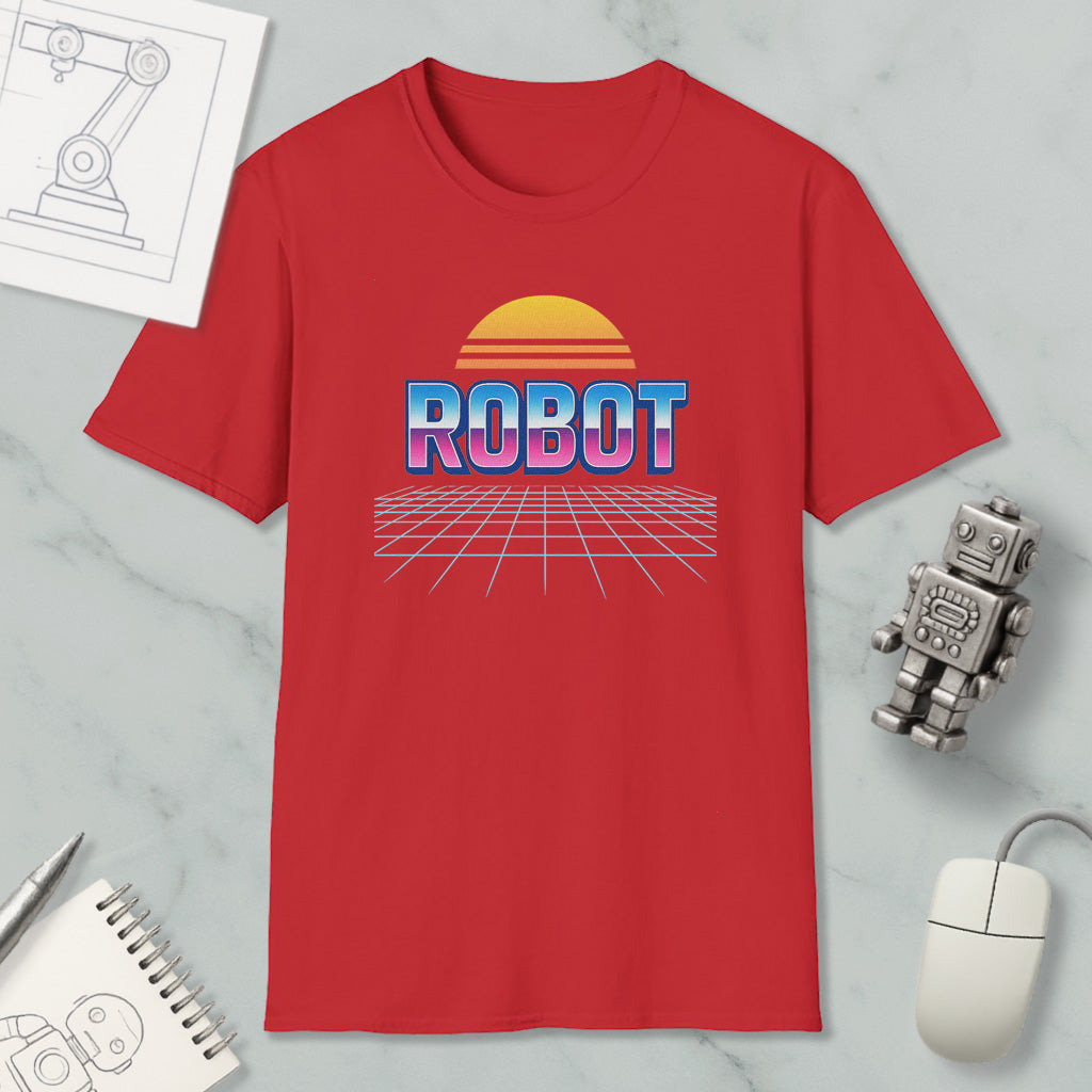 a red t-shirt with a graphic design of a robot and a sun-like shape, along with a computer mouse and other office supplies.