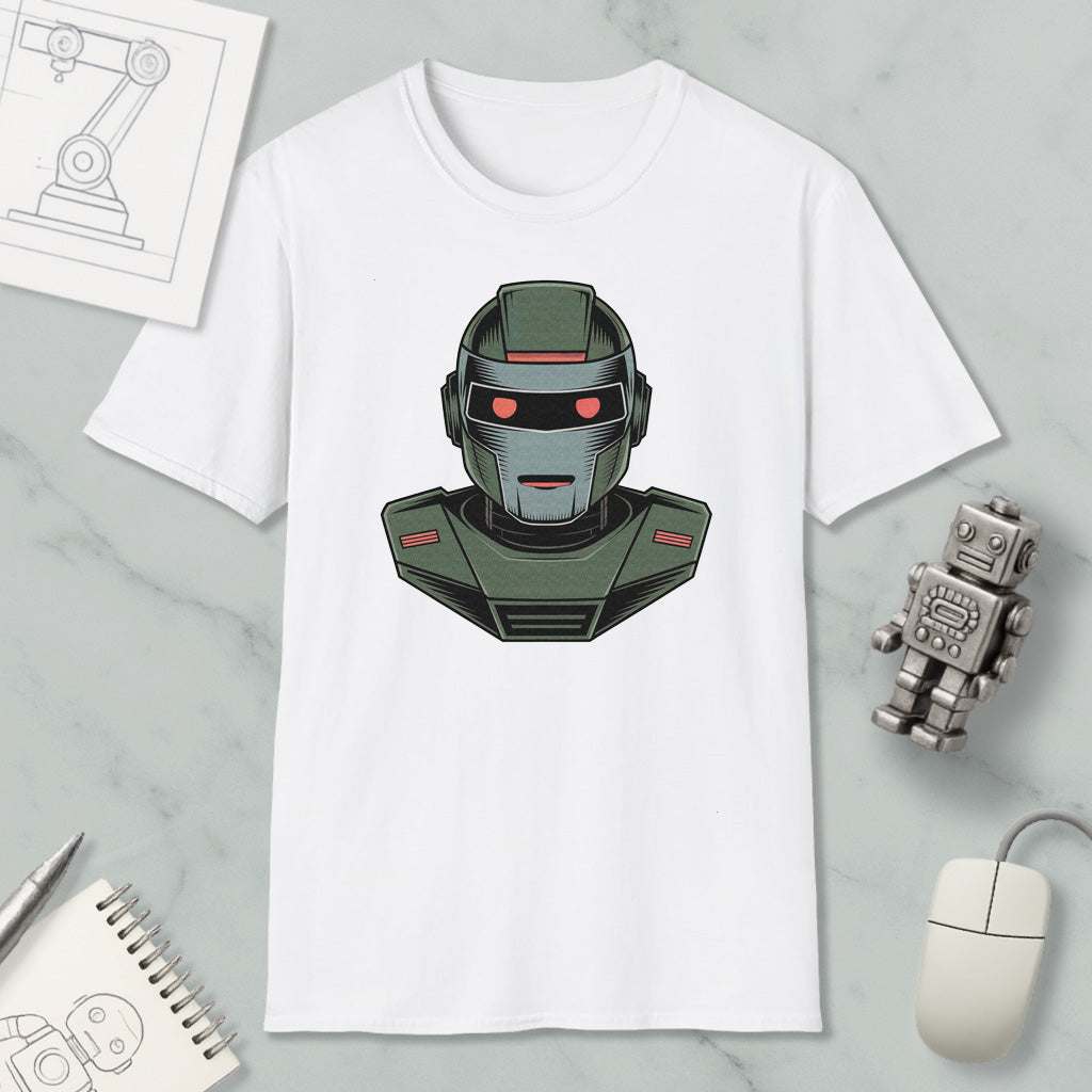 a white t-shirt with a graphic of a robot or robot-like character on it, along with various objects such as a computer mouse, a notebook, and a pen.