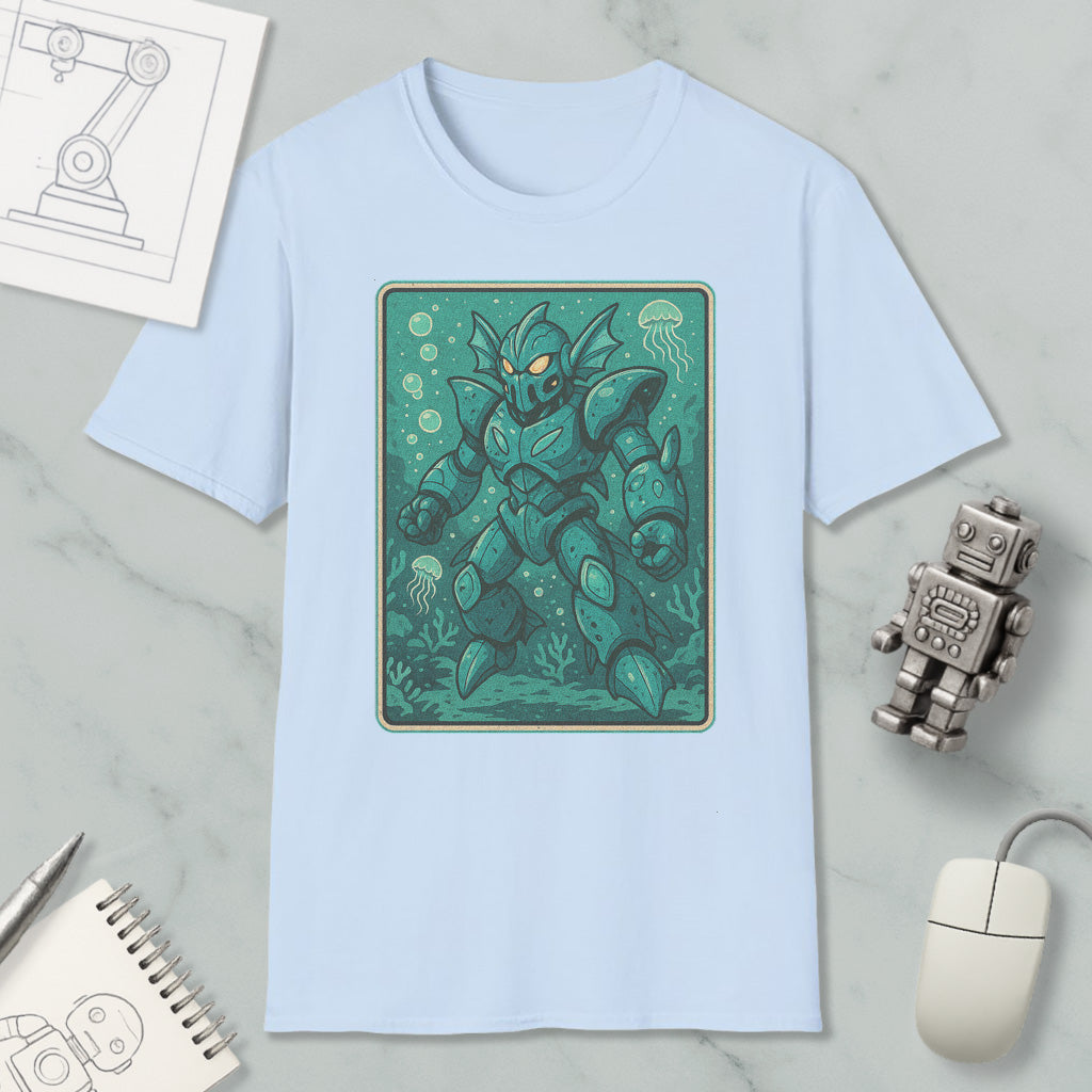 a light blue t-shirt with a graphic of a green armored robot or sea creature, surrounded by bubbles and underwater elements, placed on a marble surface alongside a computer mouse and a notebook.