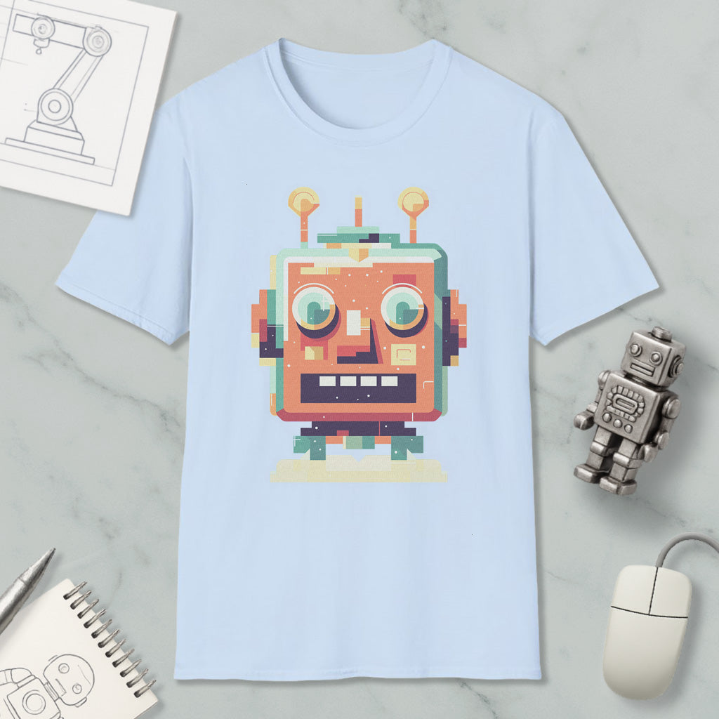 a light blue t-shirt with a colorful robot design, along with various objects such as a computer mouse, a notebook, and a pen.