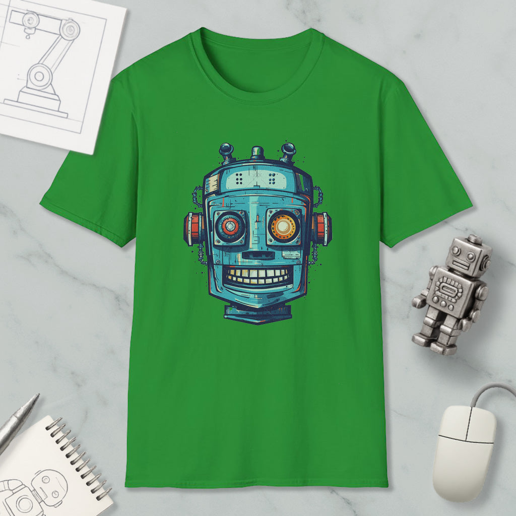 a green t-shirt with a robot design, along with a computer mouse, a notebook, and a pen on a marble surface.