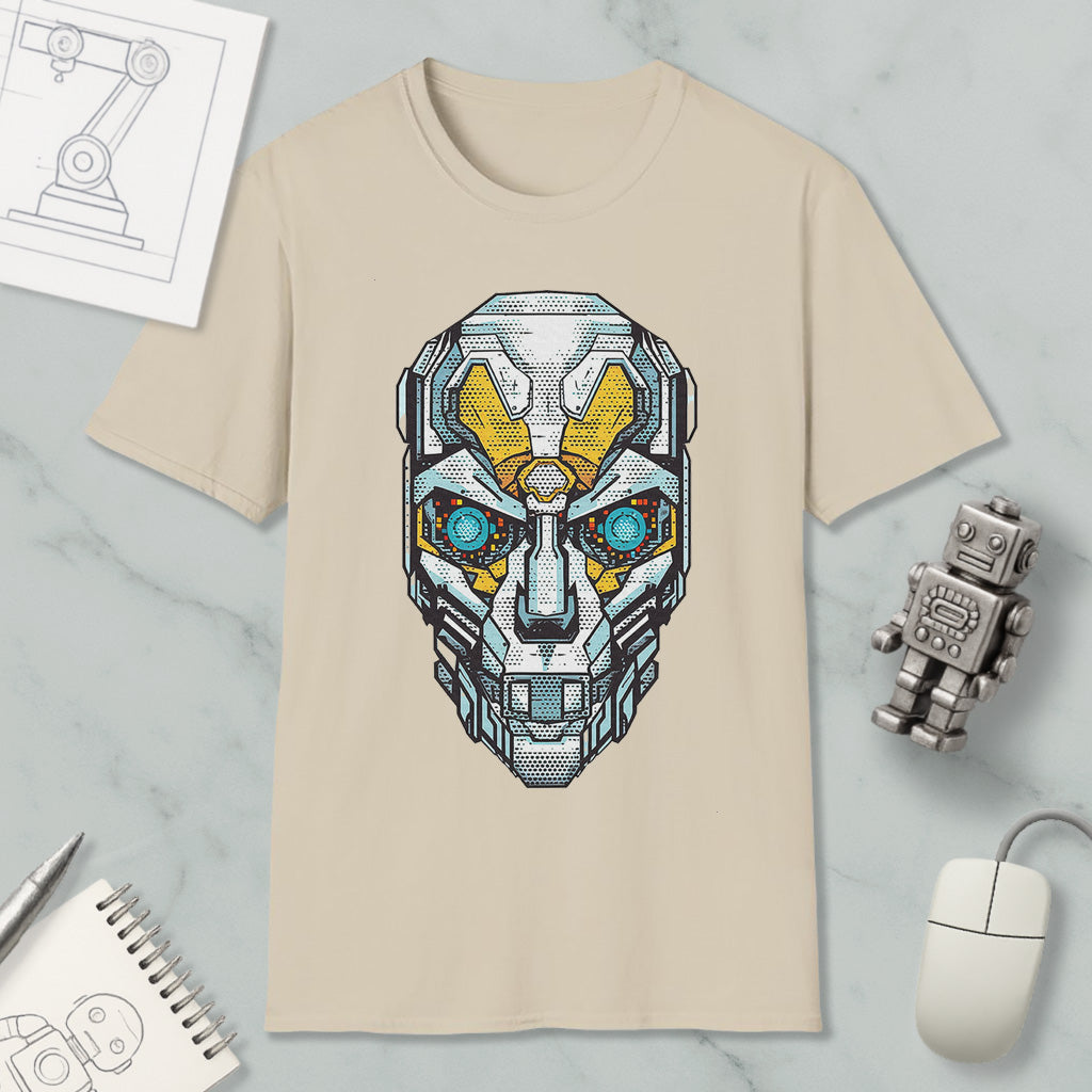 a beige t-shirt with a graphic design of a robot or cyborg head, along with various objects such as a computer mouse, a notebook, and a pen.