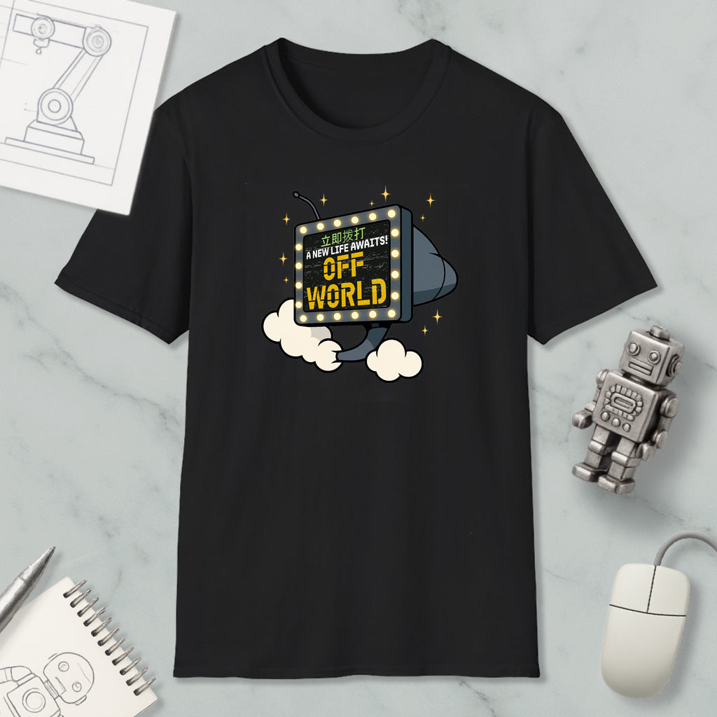 a black t-shirt with a graphic design depicting a robot or robot-like figure flying through the air with a sign that says "Off World". The t-shirt is displayed on a marble surface, along with a computer mouse, a notebook, and a small robot figurine.