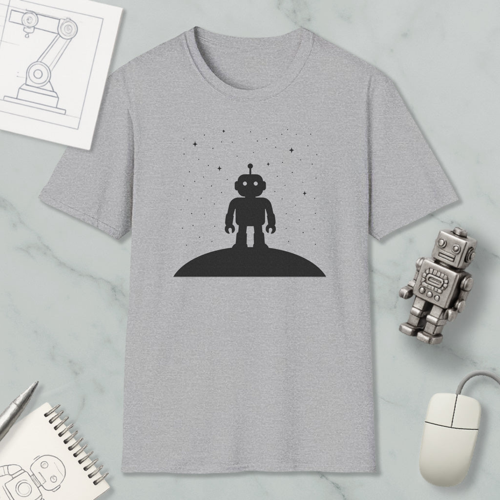 a gray t-shirt with a black silhouette of a robot standing on a hill, surrounded by stars, and a small robot figurine.