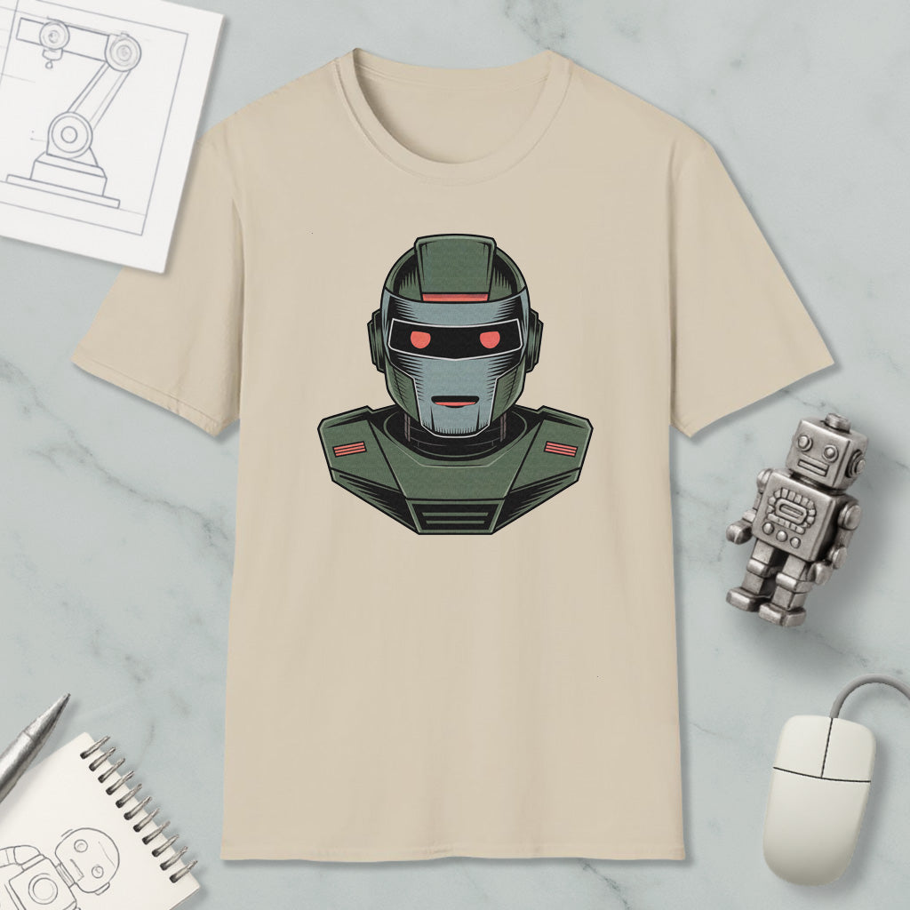 a beige t-shirt with a graphic of a robot or robot-like character, along with various objects such as a computer mouse, a notebook, and a pen.