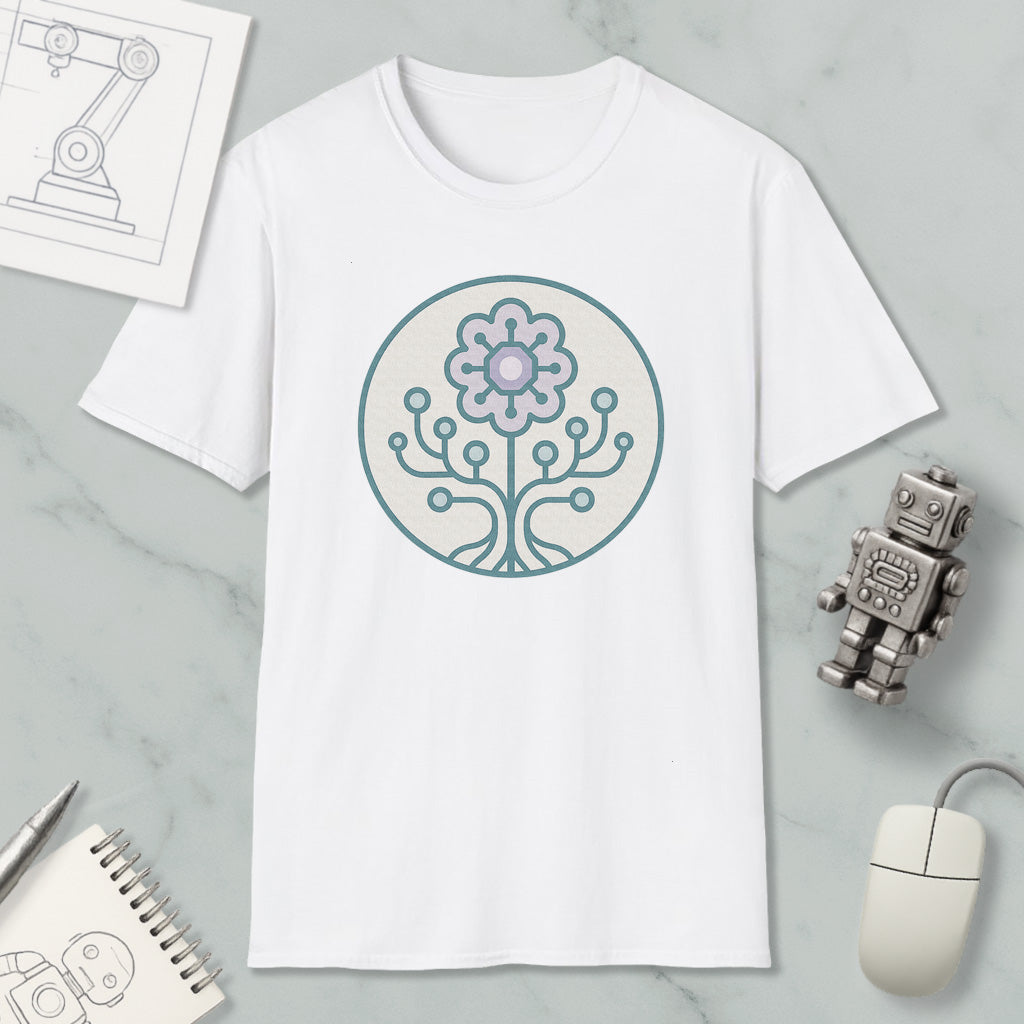 a white t-shirt with a graphic design of a flower and a tree on it, along with a computer mouse, a notebook, and a robot figurine.
