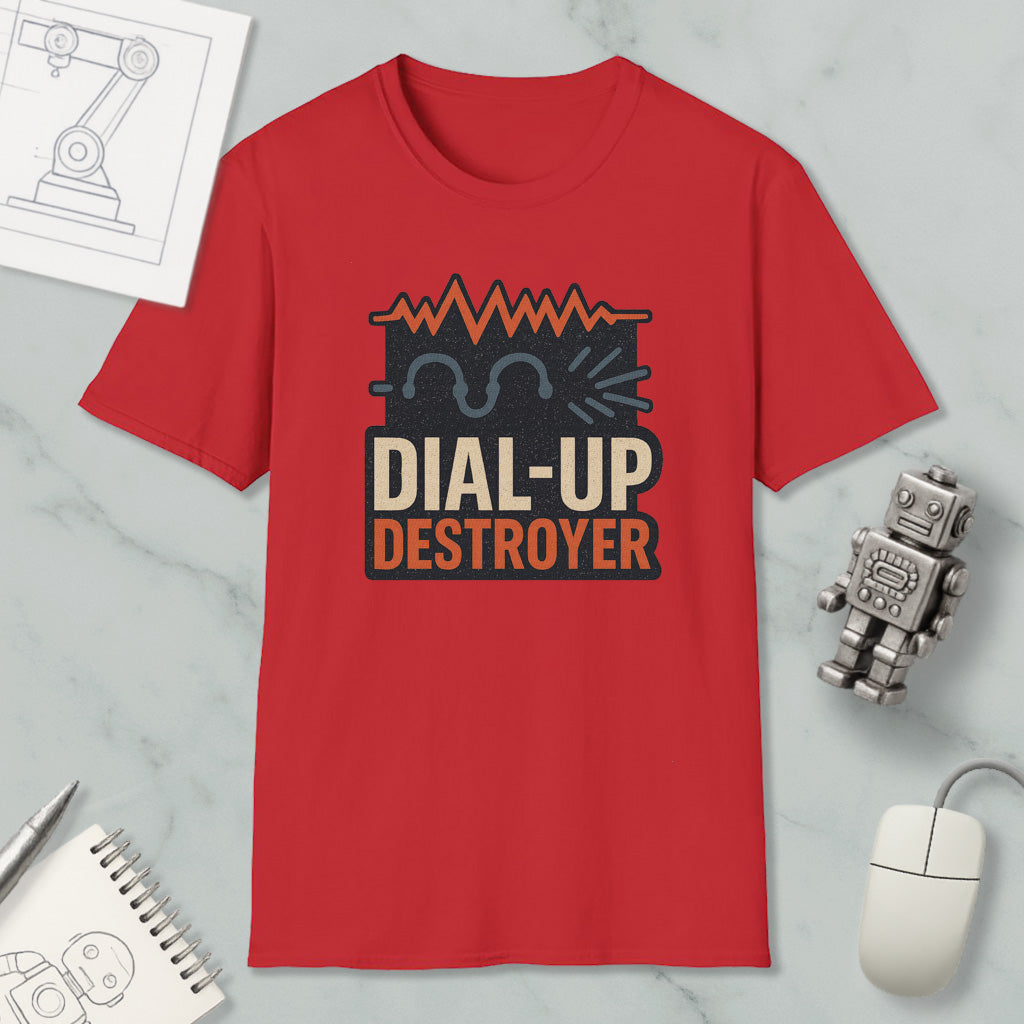 a red t-shirt with a graphic design, a computer mouse, a notebook, and a small robot on a marble surface.