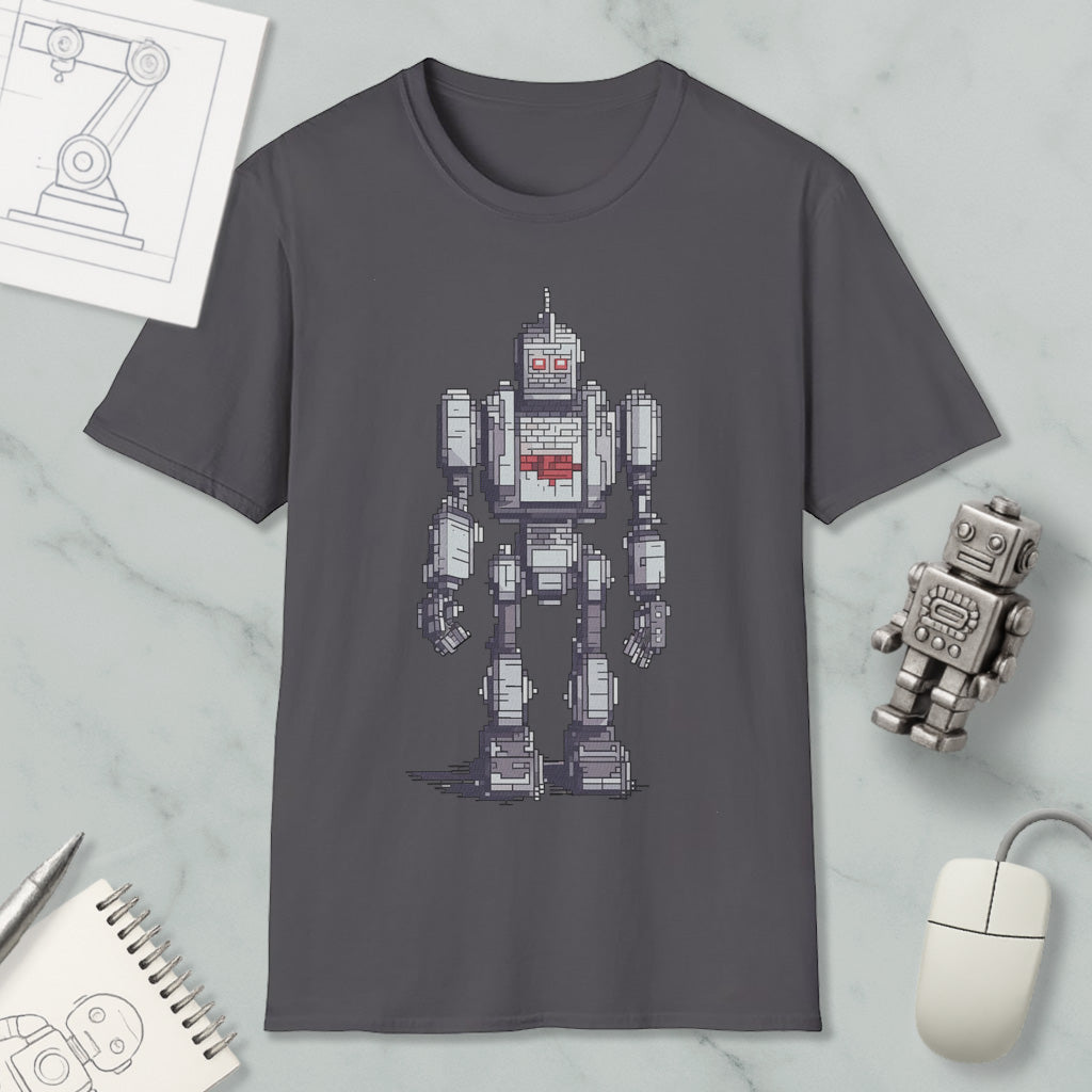a gray t-shirt with a pixelated robot design, along with a computer mouse, a notepad, and a pen on a marble surface.
