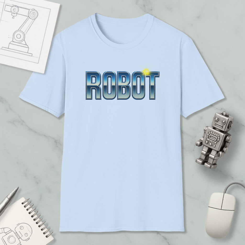a light blue t-shirt with the word "ROBOT" printed on it, along with a small robot figurine and some other items such as a notebook and a computer mouse.