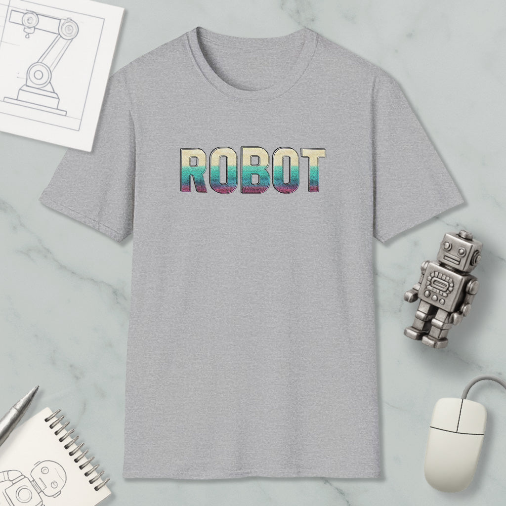a gray t-shirt with the word "ROBOT" printed on it, along with various objects such as a computer mouse, a notebook, and a robot figurine.