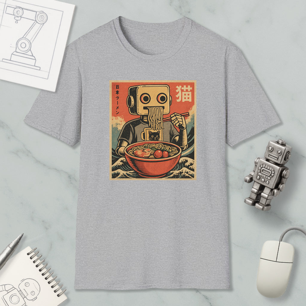 a gray t-shirt with a graphic design depicting a robot eating noodles, surrounded by various objects such as a computer mouse, a notebook, and a robot figurine.