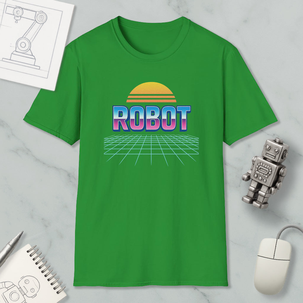 a green t-shirt with a graphic design of a robot and a sun-like shape, along with a computer mouse and other office supplies.