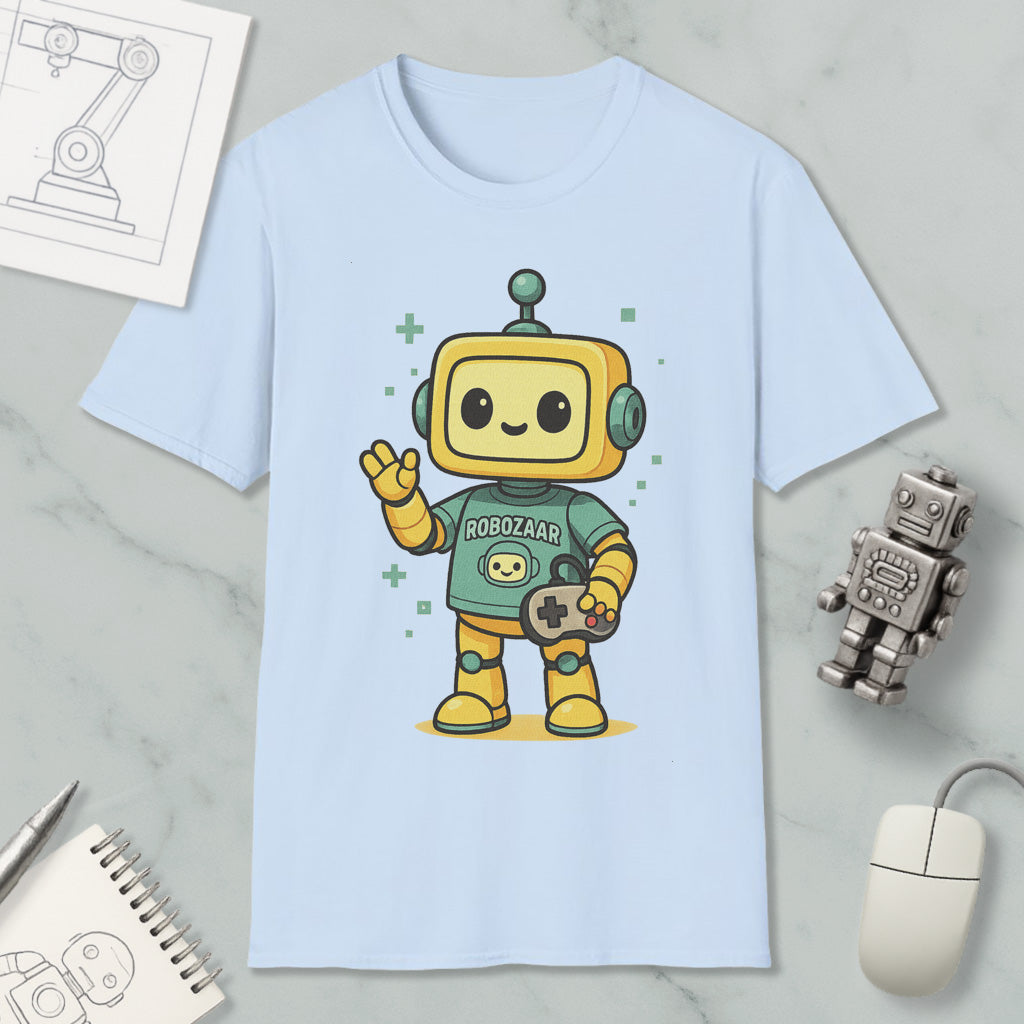 A light blue t-shirt with a cartoon robot character wearing a green shirt and holding a game controller, surrounded by various objects such as a computer mouse, a notebook, and a robot toy.