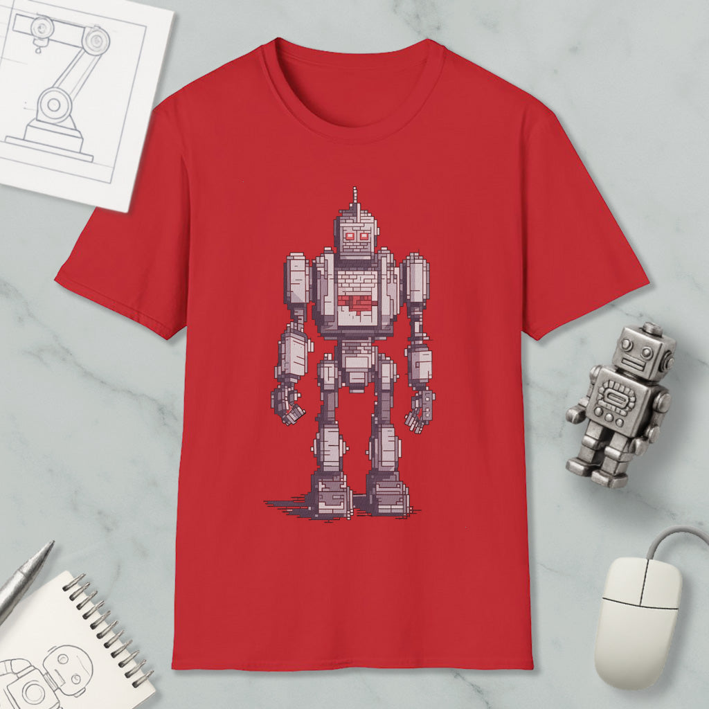 a red t-shirt with a pixelated robot design, along with various objects such as a computer mouse, a pen, and a notebook.