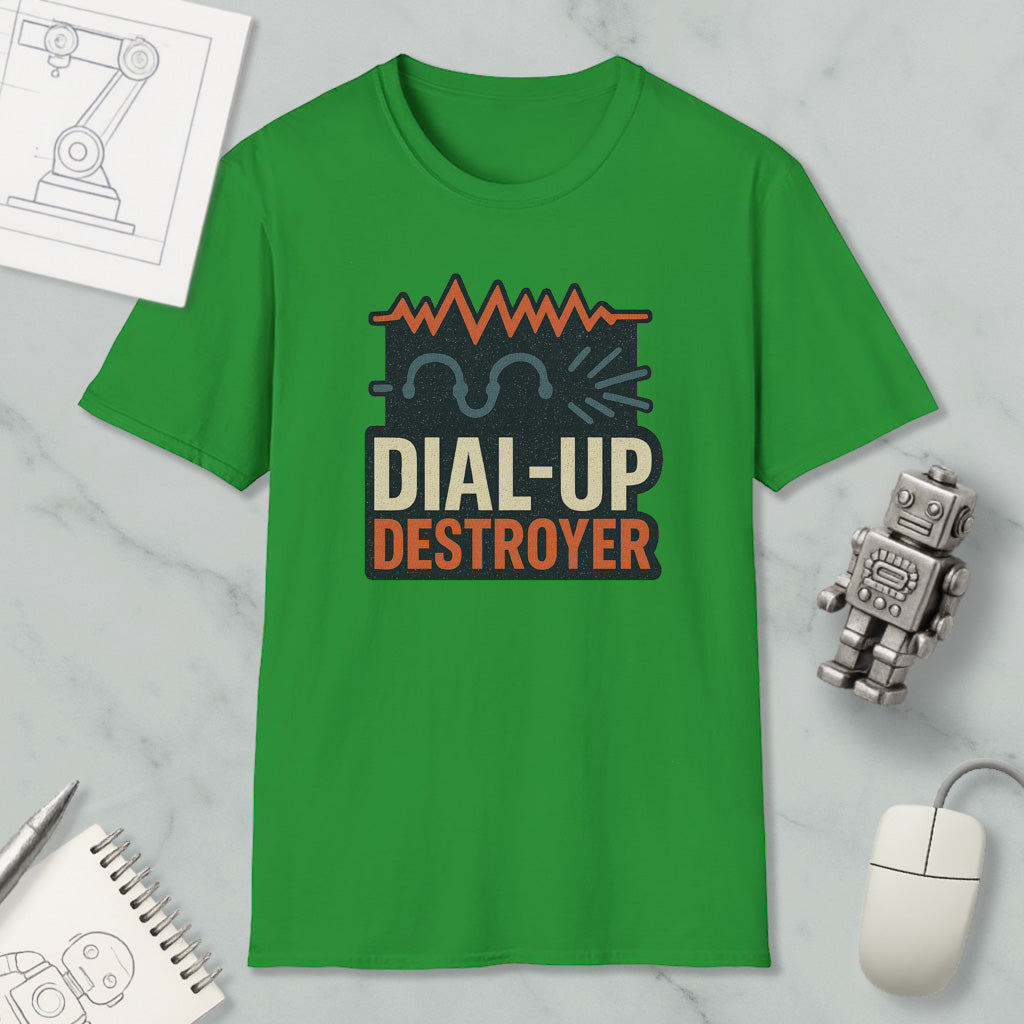 a green t-shirt with a graphic design, a computer mouse, a notebook, and a small robot on a marble surface.