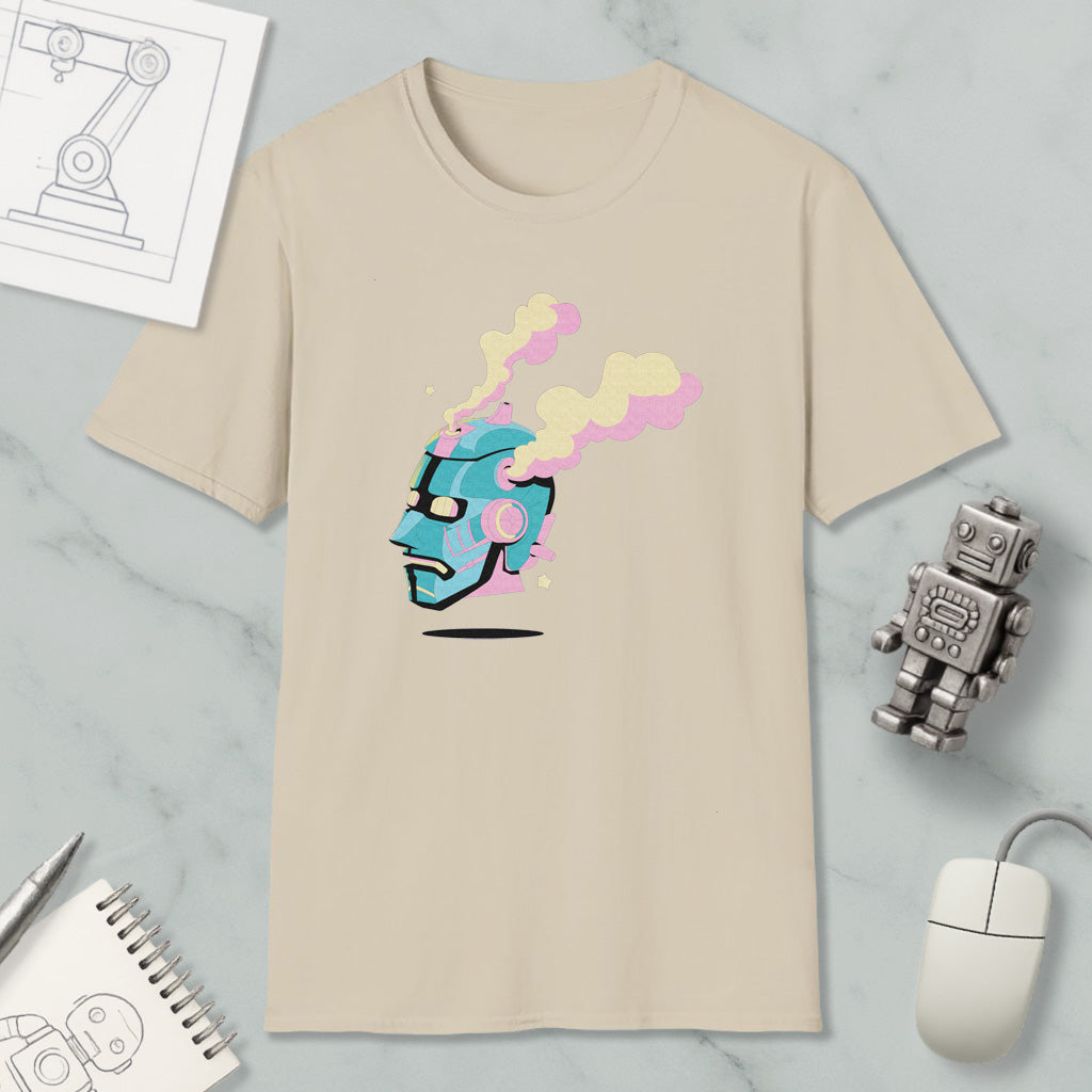 a beige t-shirt with a colorful graphic design, a small robot, a computer mouse, and a notebook on a marble surface.