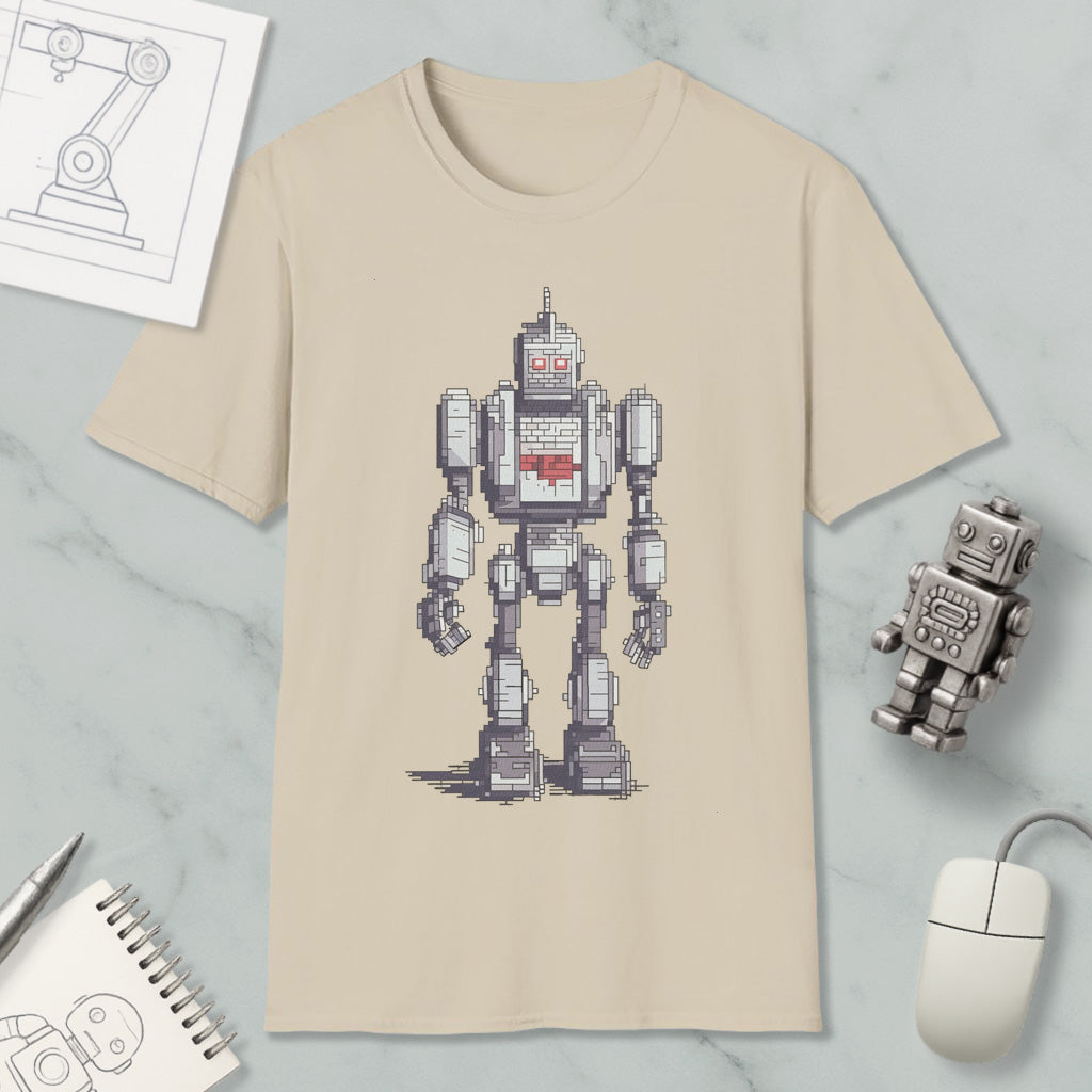 a beige t-shirt with a pixelated robot design, along with various objects such as a computer mouse, a notebook, and a pen.
