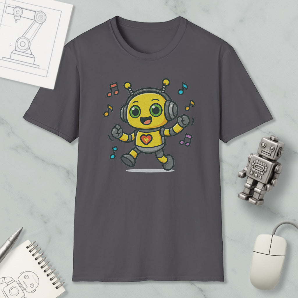 a gray t-shirt with a cartoon robot wearing headphones and dancing, surrounded by musical notes. The t-shirt is placed on a marble surface, with a computer mouse, a notepad, and a small robot figurine nearby.