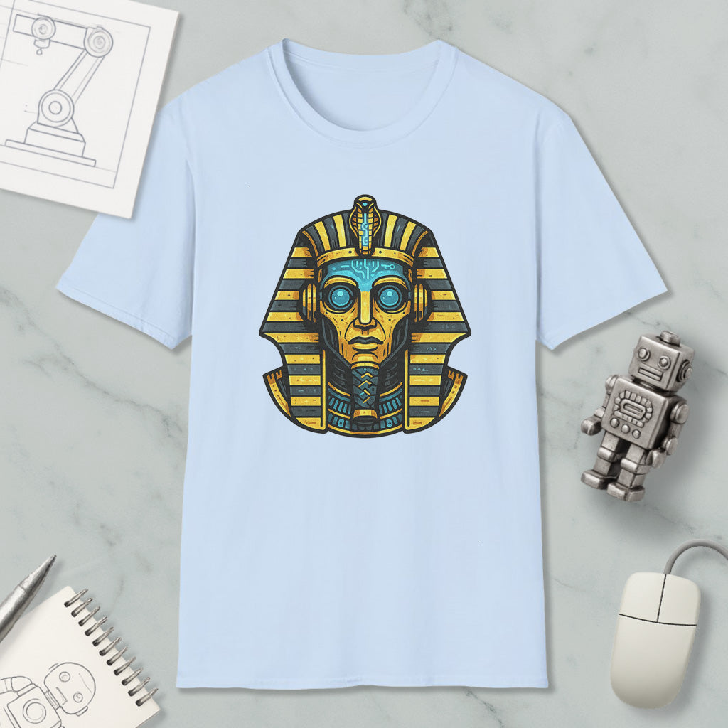 a light blue t-shirt with an illustration of an Egyptian pharaoh's head, along with various objects such as a computer mouse, a notebook, and a robot.