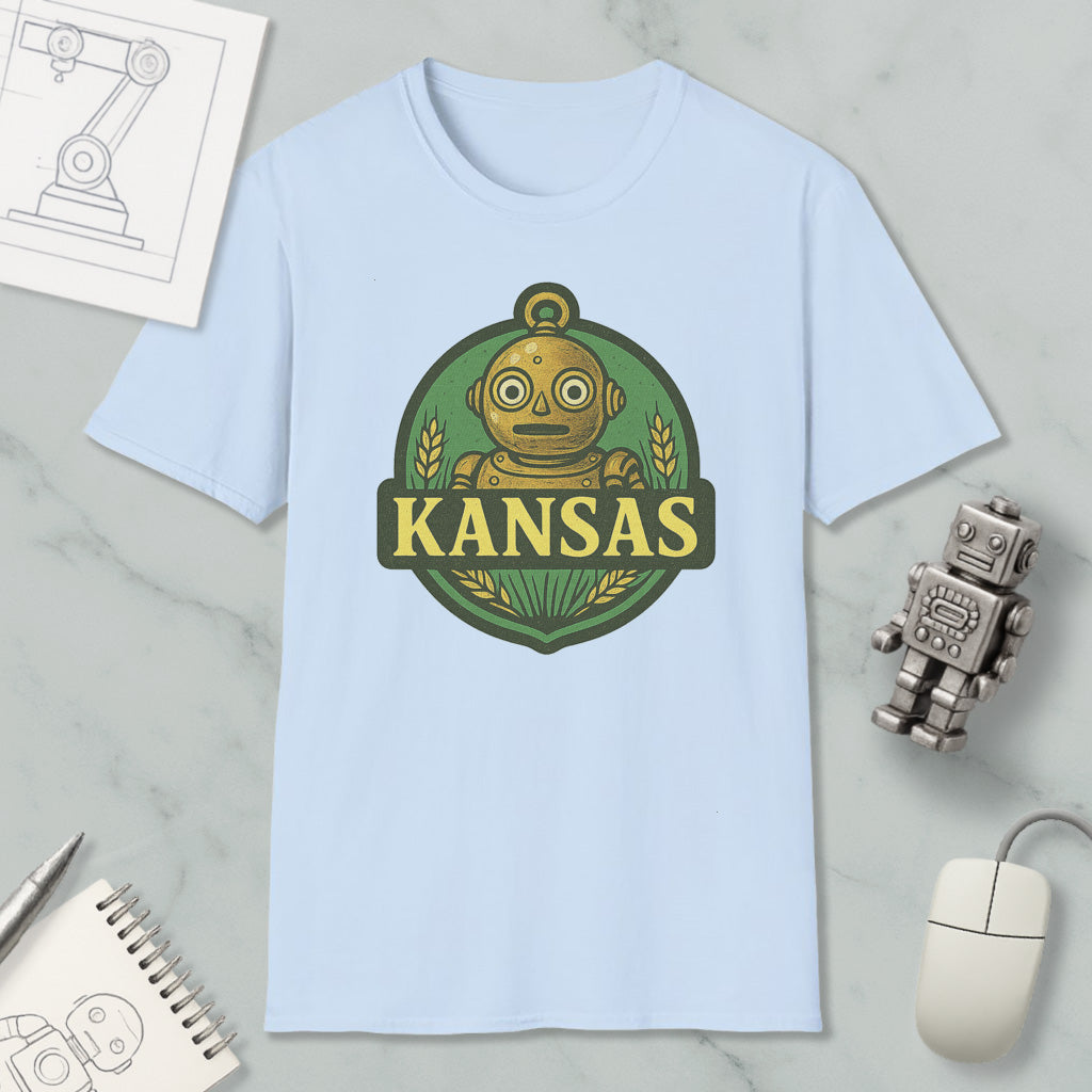 a light blue t-shirt with a graphic of a robot and the word "KANSAS" printed on it, along with a small robot and a computer mouse.