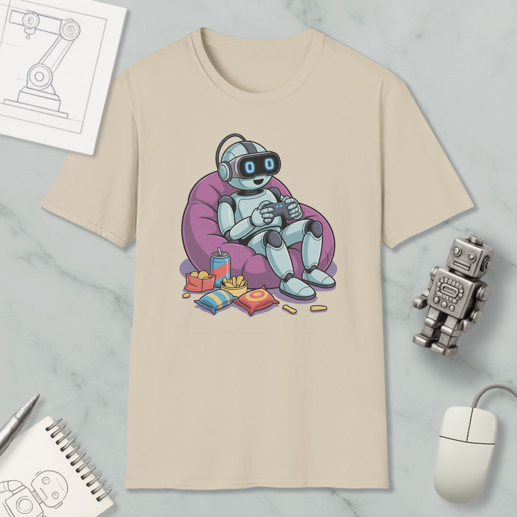 A t-shirt with a cartoon robot sitting in a bean bag chair, holding a game controller, surrounded by snacks and a toy robot.