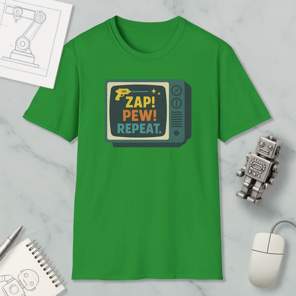 a green t-shirt with a graphic design, a computer mouse, a notebook, and a small robot on a marble surface.