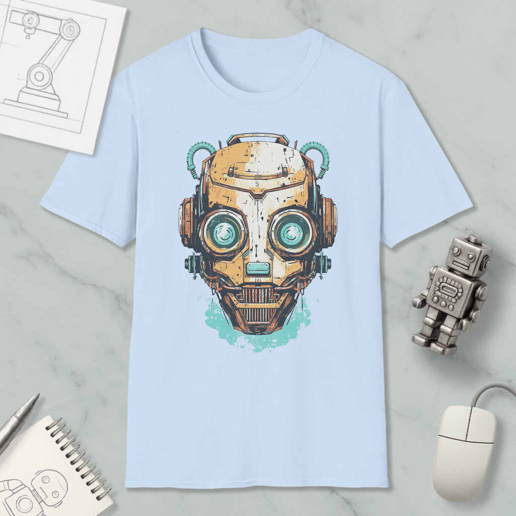 a light blue t-shirt with a graphic design of a robot or cyborg head, along with various objects such as a computer mouse, a notebook, and a pen.