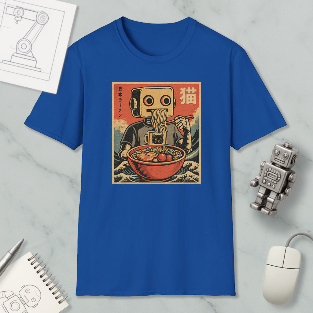 a blue t-shirt with a graphic design depicting a robot eating noodles, surrounded by various objects such as a computer mouse, a notebook, and a robot figurine.