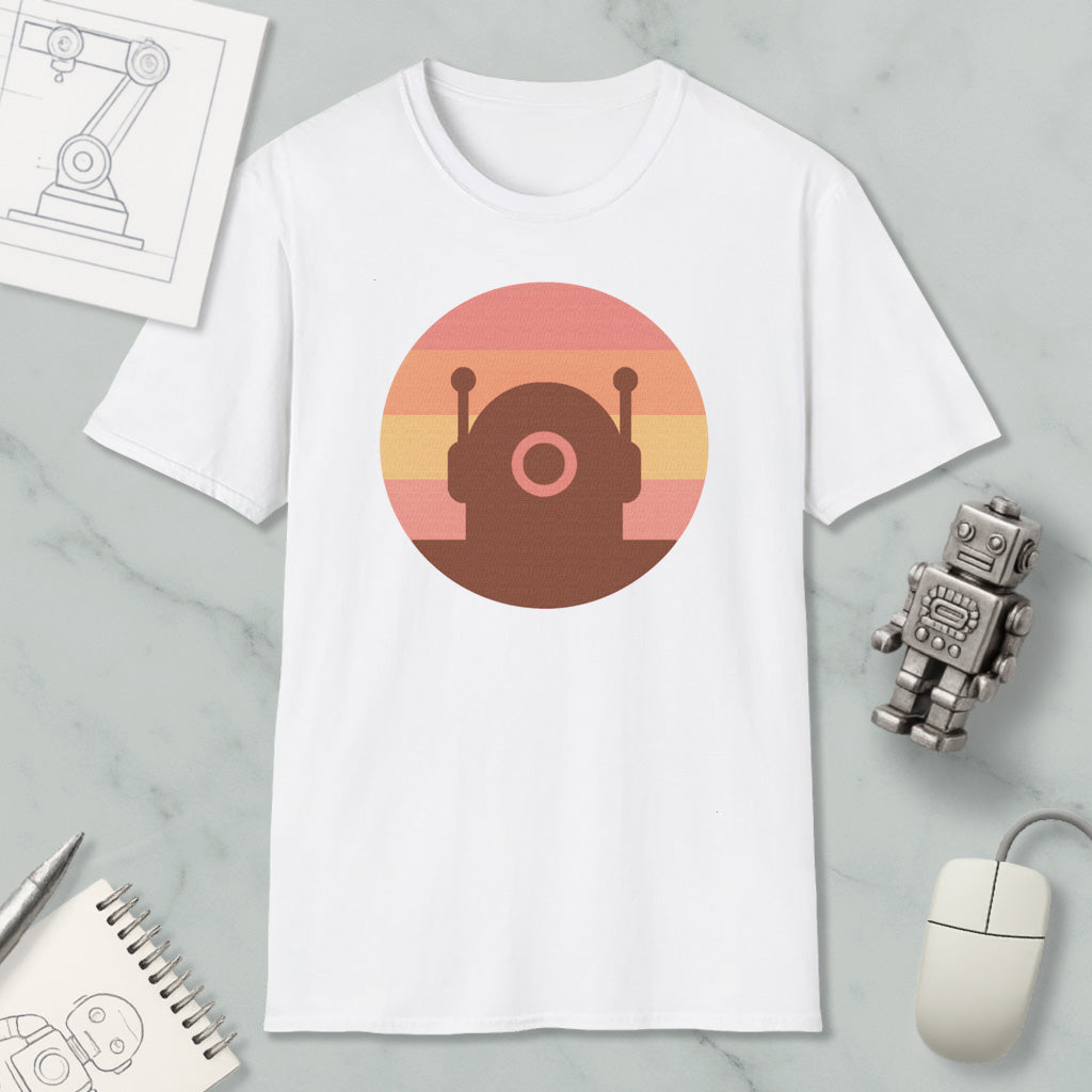 a white t-shirt with a graphic design of a robot or robot-like figure, along with various objects such as a computer mouse, a notebook, and a pen.