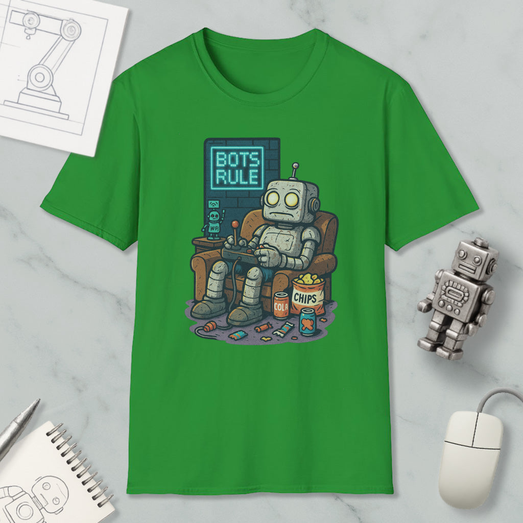 a green t-shirt with a cartoon robot sitting in a chair, holding a remote control and surrounded by various objects such as a computer mouse, a notebook, and a can of chips.