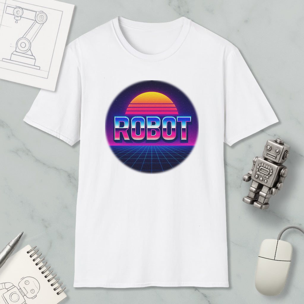 a white t-shirt with a graphic design of a robot and a sunset, along with various objects such as a computer mouse, a notebook, and a pen.