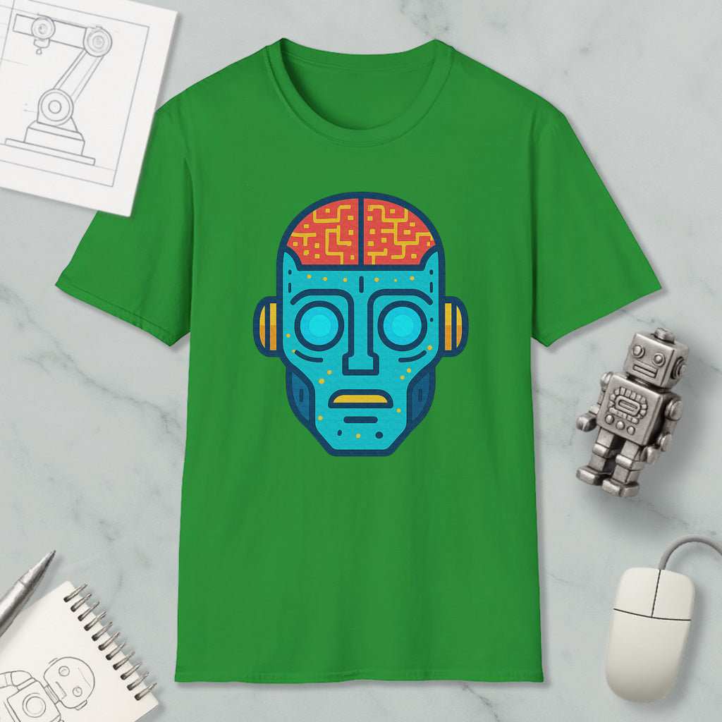 a green t-shirt with a colorful robot or humanoid face design, along with various objects such as a computer mouse, a notebook, and a pen.