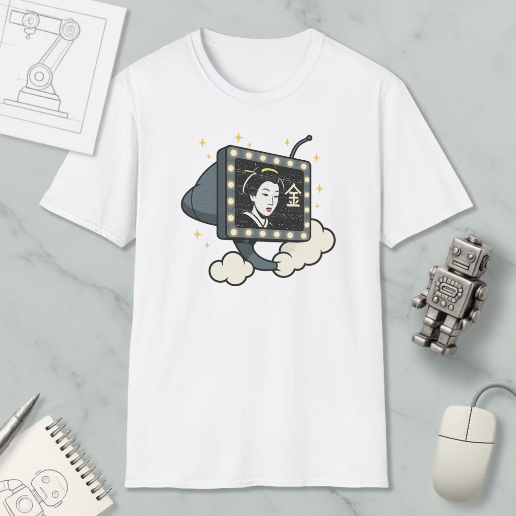 a white t-shirt with a graphic design depicting a woman's face on a television screen, surrounded by stars. The t-shirt is placed on a marble surface, with a computer mouse, a robot, and a notebook nearby.